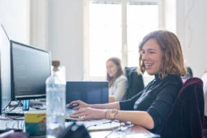 International Women's Day. The picture shows two women working in an office. They are working on IT-specific problems. Women in STEM professions are becoming increasingly common.